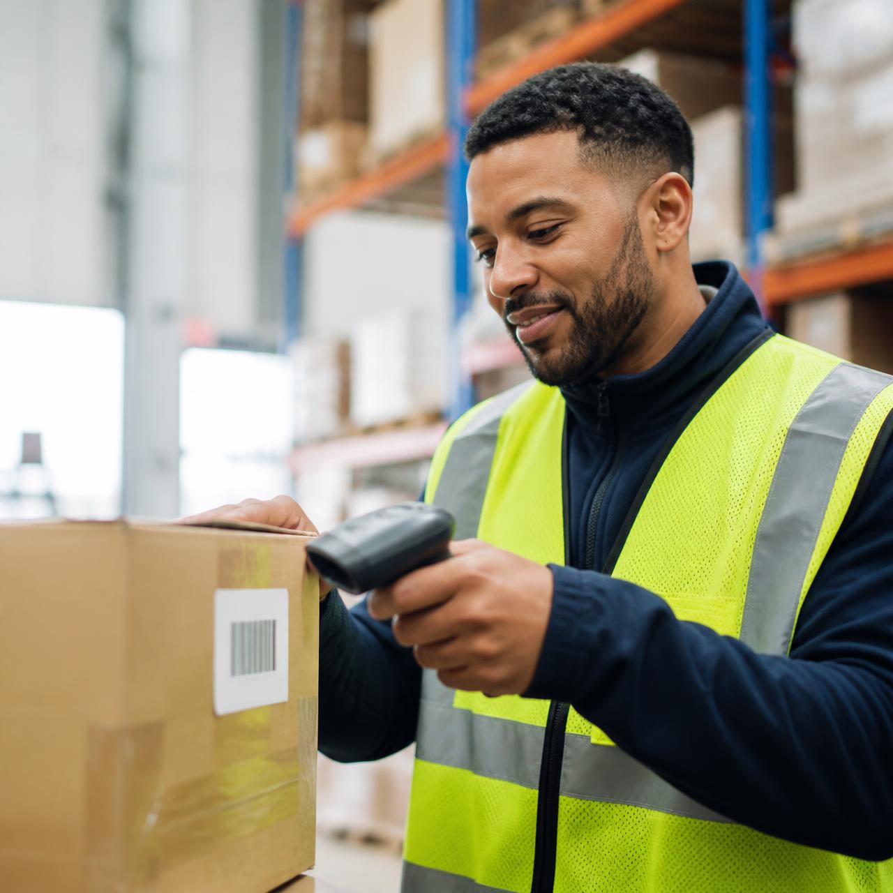 SummitStore team member scanning stock in the warehouse